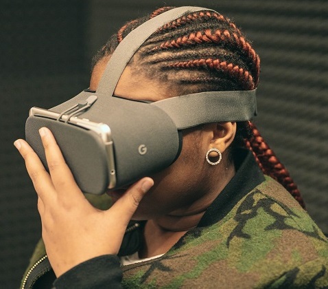 A black student wearing a virtual reality headset