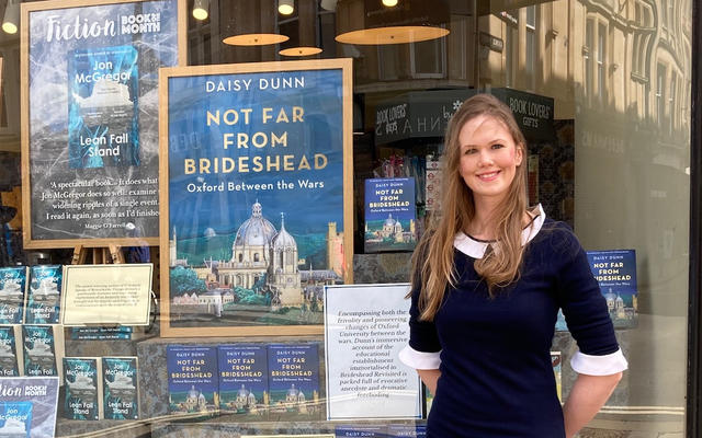 Daisy Dunn with her book outside a shop