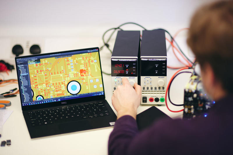 Person configures computer and batteries