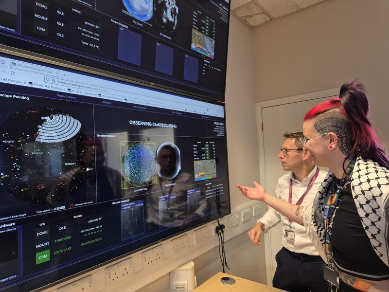 Dr Héloïse Stevance and Professor Stephen Smartt with the Asteroid Terrestrial Impact Last Alert System (ATLAS), in the Astrophysics Data Lab, University of Oxford. 