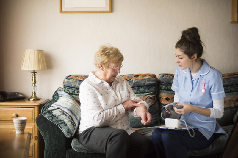A resident being treated by a nurse in a UK Care Home