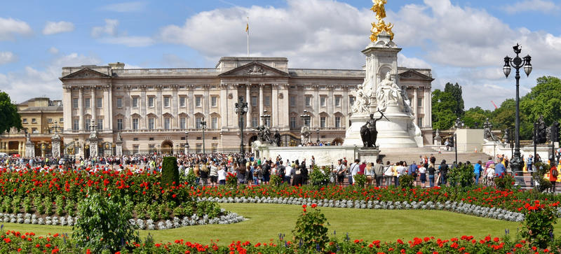 Buckingham Palace - with flower beds and the Queen Victoria Memorial in the foreground