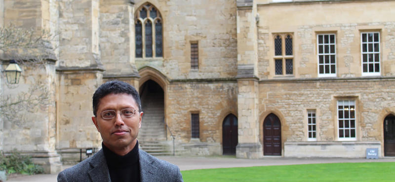 Masud Husain stood in a quad of an Oxford college
