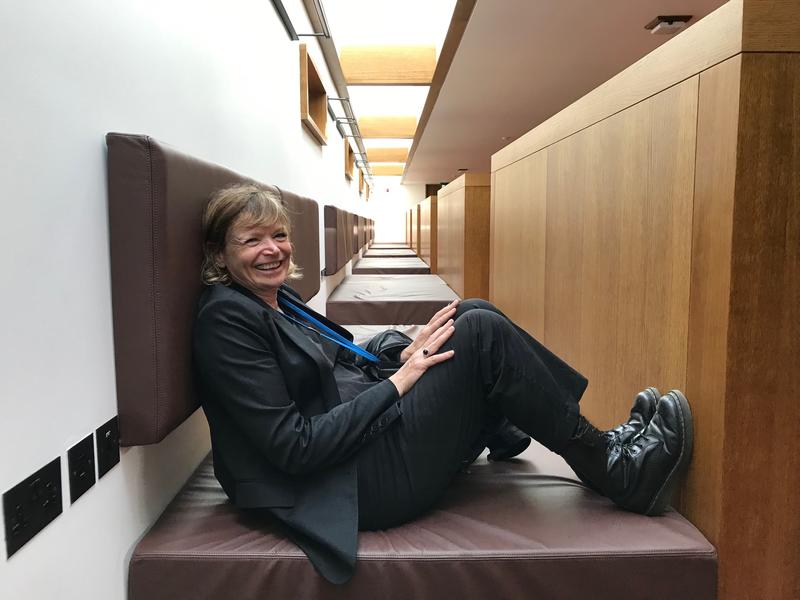 Claire Wright sitting on one of the study 'beds' in the library