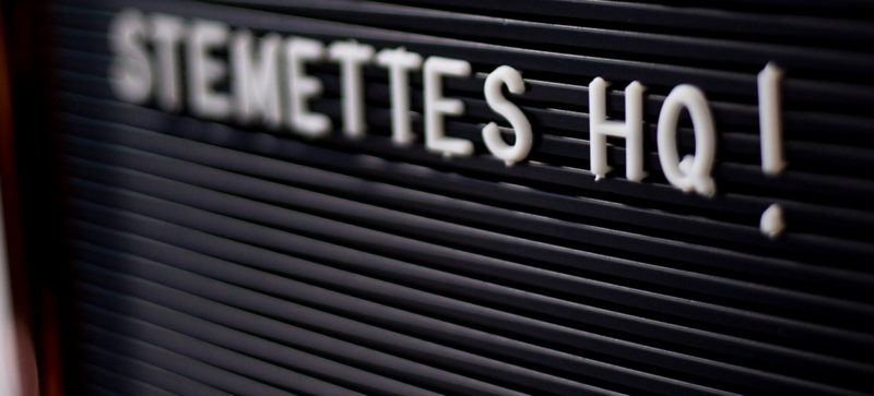 A pushboard with letters spelling out 'STEMETTES HQ!'
