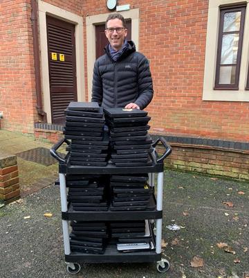 Ben Tuppen collecting laptops