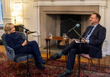 Hillary Rodham Clinton with Adam Smith during a recording of his podcast The Last Best Hope