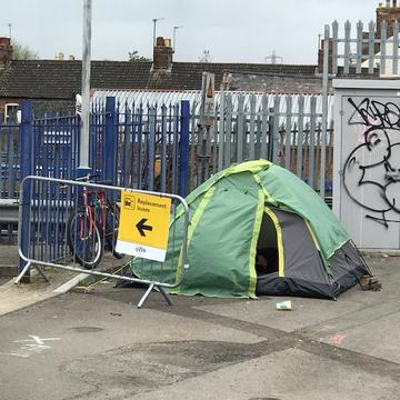 Tented homeless person 